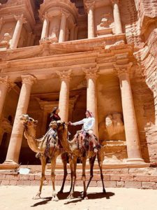 Women riding camels in Petra, Jordan