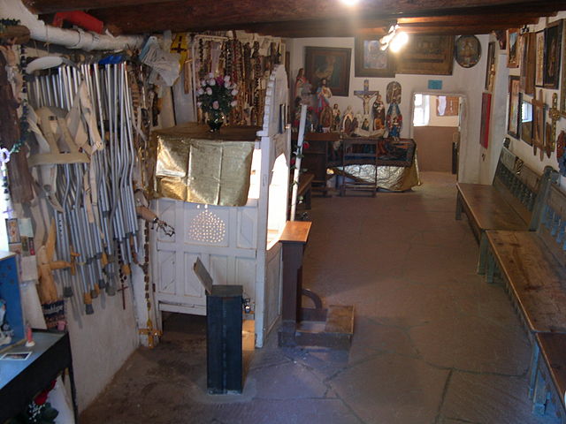 crutches on wall in chimayo sanctuary