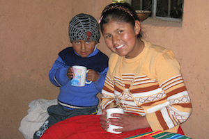 Peru children drinking cocao