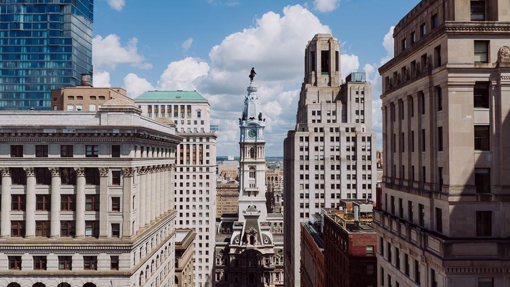 Philadelphia City Hall surrounded by Center City buildings.